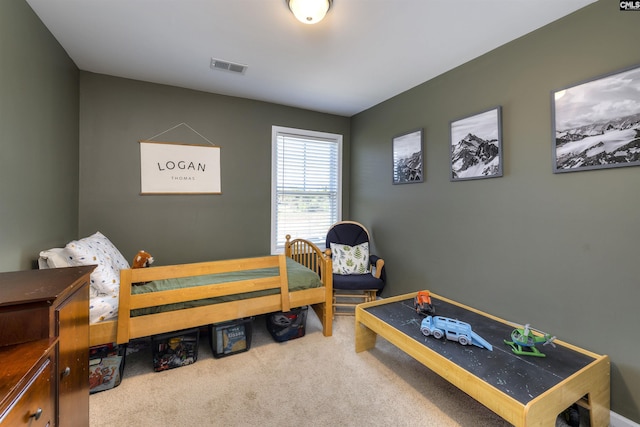 carpeted bedroom with visible vents