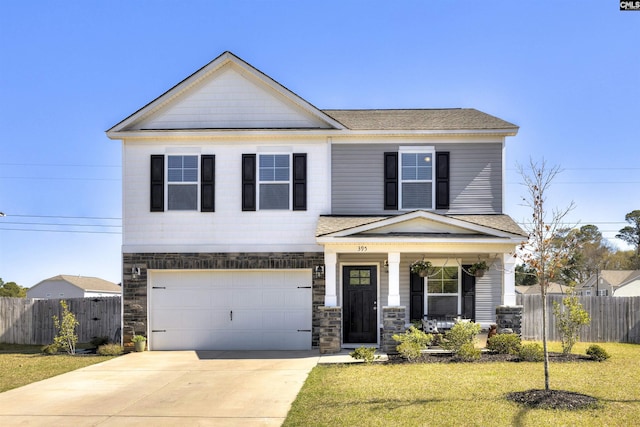 view of front of property with covered porch, fence, a front lawn, an attached garage, and concrete driveway