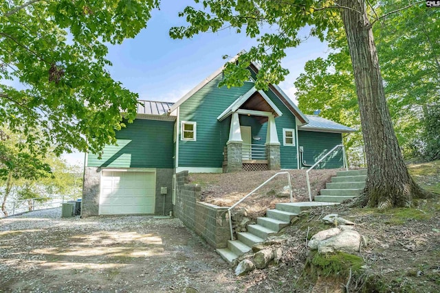 1724 Gold Nugget Pt, Prosperity, SC 29127 - view of front of property featuring a standing seam roof, an attached garage, metal roof, fence, and driveway
