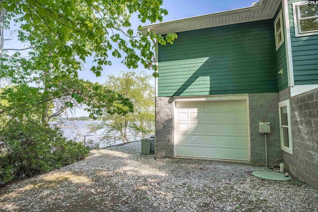 1724 Gold Nugget Pt, Prosperity, SC 29127 - view of home's exterior with driveway, central air condition unit, fence, and an attached garage