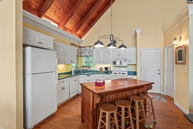 1724 Gold Nugget Pt, Prosperity, SC 29127 - kitchen with white appliances, butcher block counters, white cabinets, beamed ceiling, and wood ceiling
