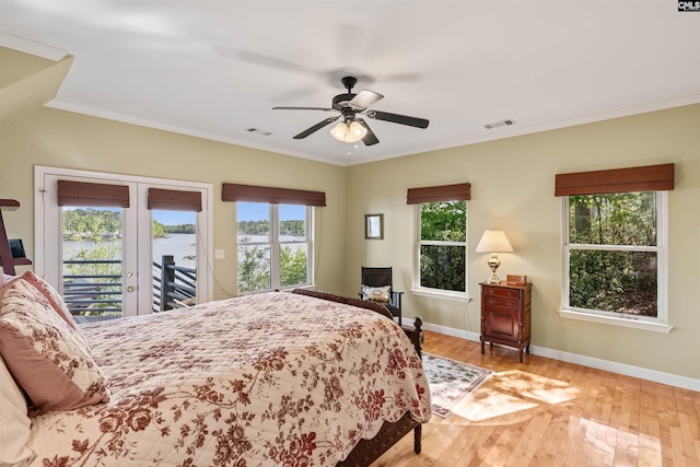 1724 Gold Nugget Pt, Prosperity, SC 29127 - bedroom with a water view, access to outside, multiple windows, and light wood-style flooring