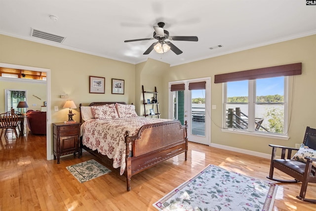 1724 Gold Nugget Pt, Prosperity, SC 29127 - bedroom featuring crown molding, visible vents, access to outside, and light wood-style floors