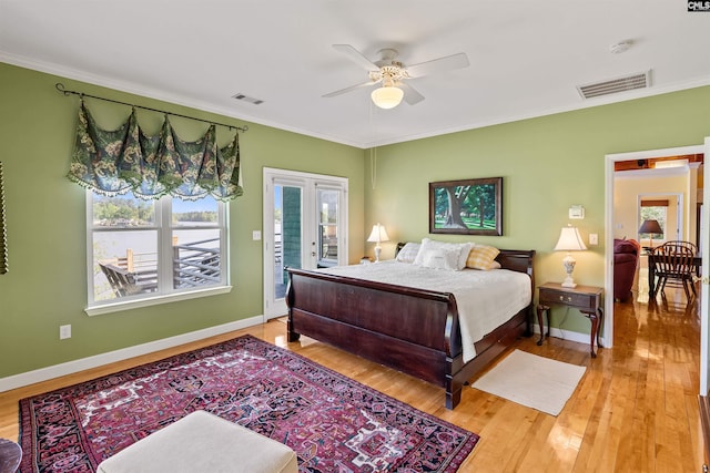 1724 Gold Nugget Pt, Prosperity, SC 29127 - bedroom featuring access to exterior, wood finished floors, ornamental molding, and visible vents