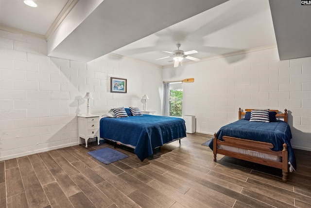 1724 Gold Nugget Pt, Prosperity, SC 29127 - bedroom featuring dark wood-style floors, ornamental molding, and concrete block wall