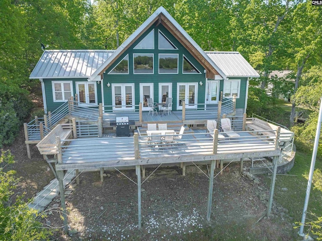 1724 Gold Nugget Pt, Prosperity, SC 29127 - back of property with french doors, metal roof, and a wooden deck