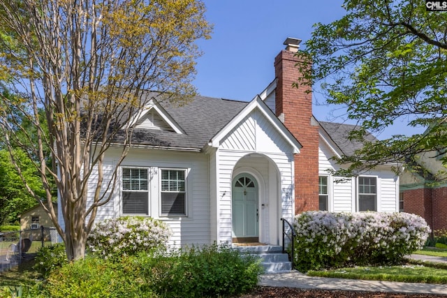 604 Oakland Ave, Cayce, SC 29033 - bungalow-style home with fence, a shingled roof, and a chimney