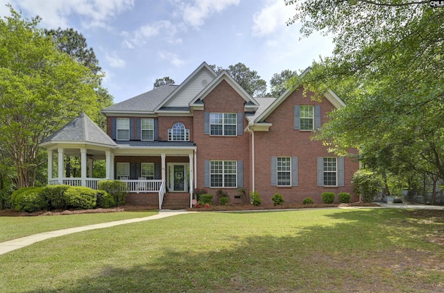 304 Oakhurst Pl, Blythewood, SC 29016 - view of front of home featuring roof with shingles, brick siding, a front lawn, and covered porch