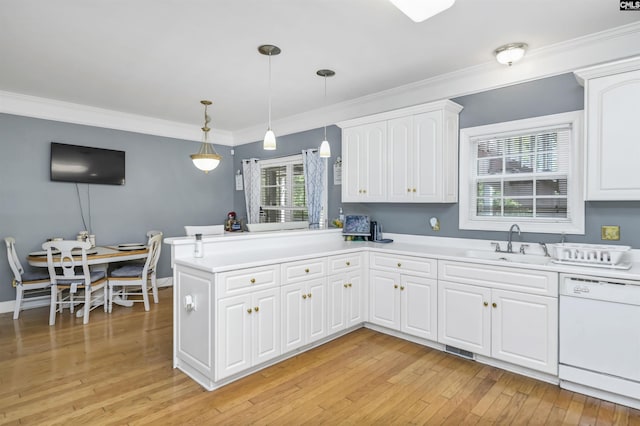 304 Oakhurst Pl, Blythewood, SC 29016 - kitchen featuring a peninsula, light countertops, white cabinets, dishwasher, and a sink