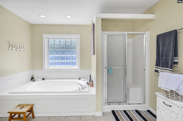304 Oakhurst Pl, Blythewood, SC 29016 - full bath featuring a shower stall, tile patterned flooring, a garden tub, and recessed lighting