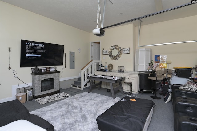 304 Oakhurst Pl, Blythewood, SC 29016 - living area featuring a fireplace, dark carpet, electric panel, stairs, and baseboards