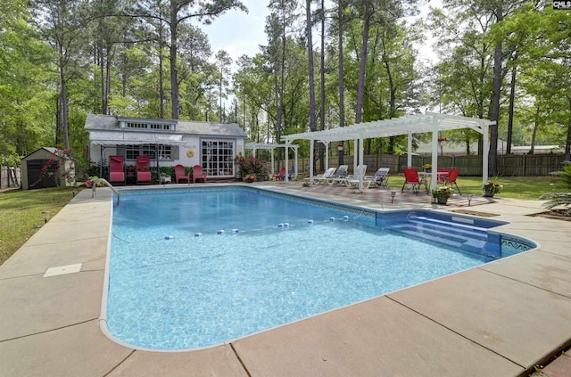 304 Oakhurst Pl, Blythewood, SC 29016 - view of swimming pool with a pergola, a patio, a fenced backyard, and an outbuilding