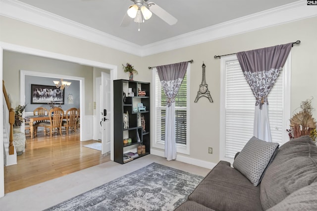 304 Oakhurst Pl, Blythewood, SC 29016 - living room with ornamental molding and ceiling fan with notable chandelier