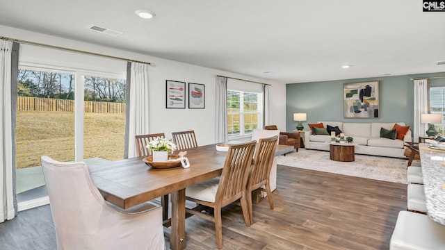 dining area featuring dark wood-style flooring, visible vents, and recessed lighting