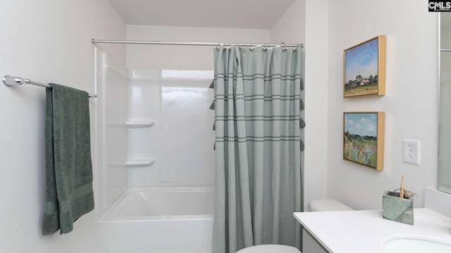 full bathroom featuring shower / bath combo with shower curtain, vanity, and toilet