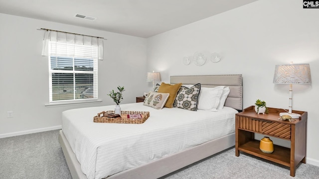 bedroom featuring visible vents, baseboards, and carpet flooring