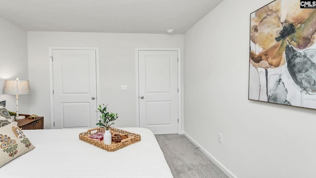bedroom featuring carpet flooring and baseboards