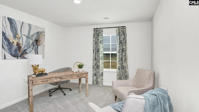 office area featuring carpet flooring, baseboards, and visible vents