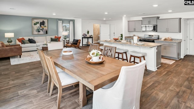 dining room featuring recessed lighting and dark wood finished floors