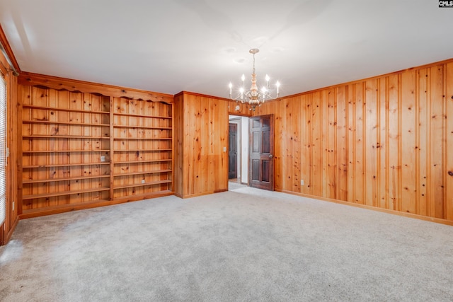 1605 Quail Lake Dr, West Columbia, SC 29169 - unfurnished room featuring wooden walls, a notable chandelier, and carpet