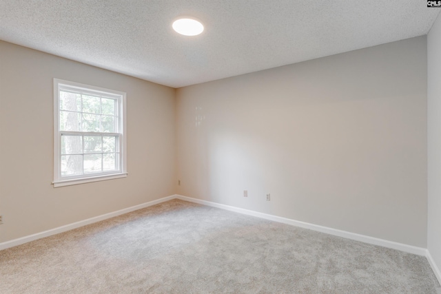 1605 Quail Lake Dr, West Columbia, SC 29169 - empty room featuring carpet flooring, a textured ceiling, and baseboards