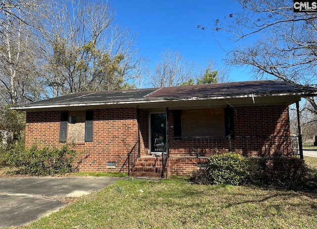 1115 Robinson St, Hartsville, SC 29550 - ranch-style house with a front yard, brick siding, and covered porch