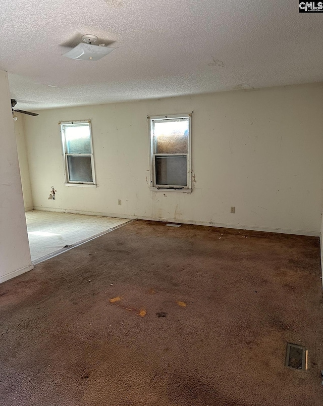 1115 Robinson St, Hartsville, SC 29550 - carpeted spare room featuring visible vents and a textured ceiling