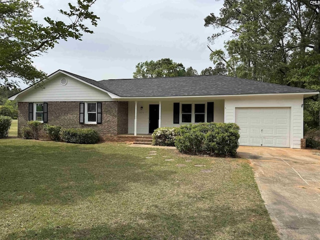 single story home featuring concrete driveway, a front lawn, a porch, brick siding, and a garage