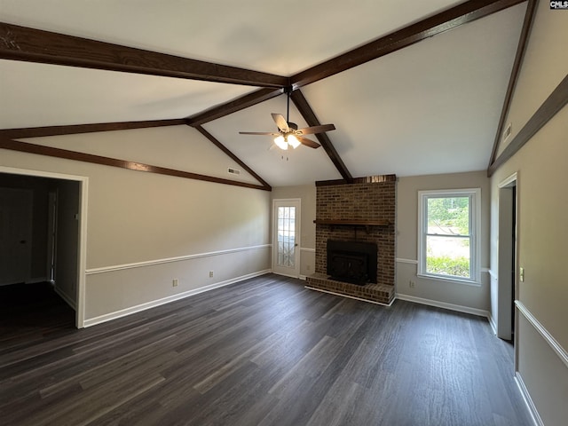 unfurnished living room featuring dark wood-type flooring, a ceiling fan, plenty of natural light, and a brick fireplace