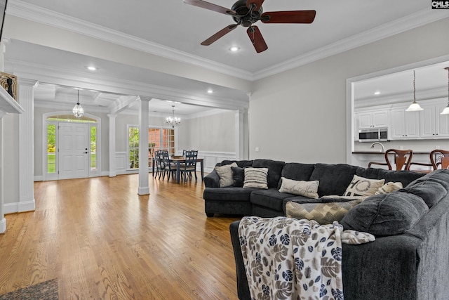 124 Loch Levin Ln, Lexington, SC 29072 - living room featuring light wood-type flooring, ornamental molding, recessed lighting, ornate columns, and ceiling fan with notable chandelier