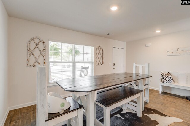 dining area with baseboards, recessed lighting, and wood finished floors