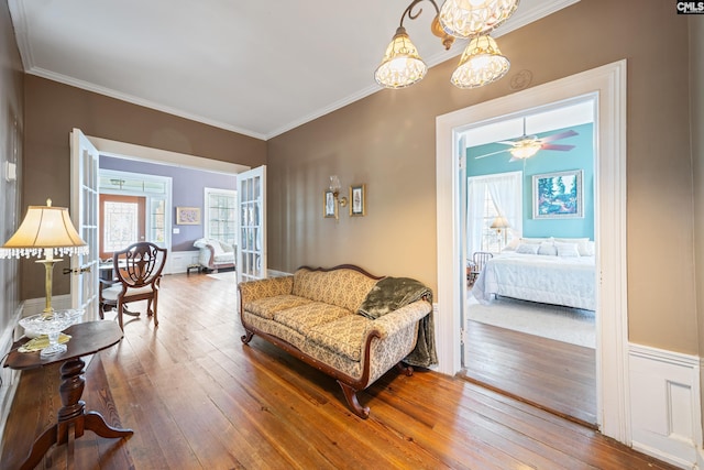 131 Pine St, Salley, SC 29137 - living room with ornamental molding, an inviting chandelier, and hardwood / wood-style flooring