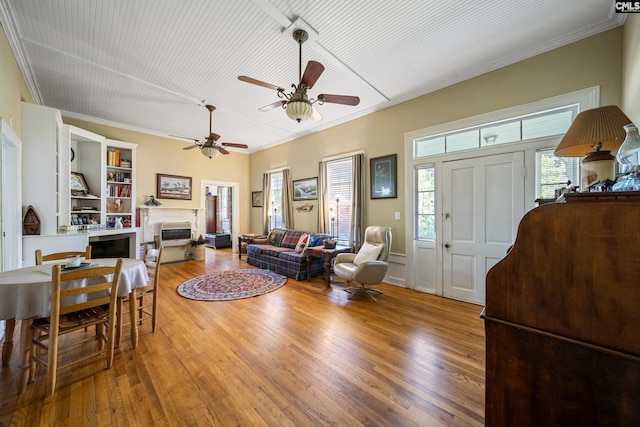 131 Pine St, Salley, SC 29137 - living room featuring a ceiling fan, wood finished floors, a fireplace, and ornamental molding