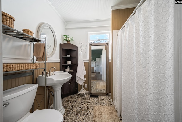 131 Pine St, Salley, SC 29137 - bathroom featuring tile patterned floors, wainscoting, ornamental molding, and toilet