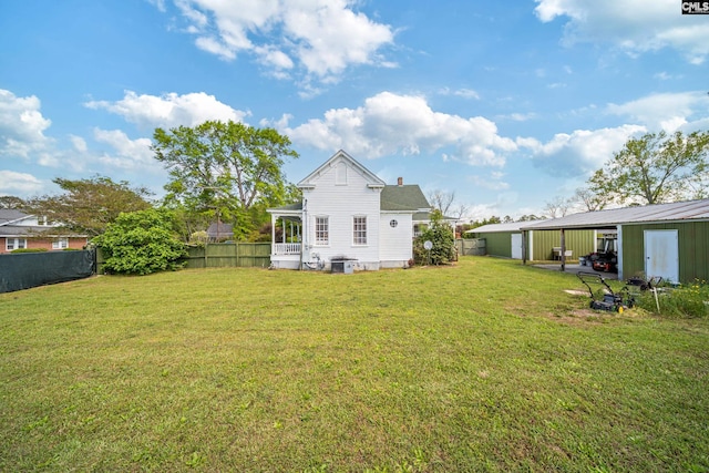 131 Pine St, Salley, SC 29137 - back of property featuring an outbuilding, a fenced backyard, a pole building, and a lawn