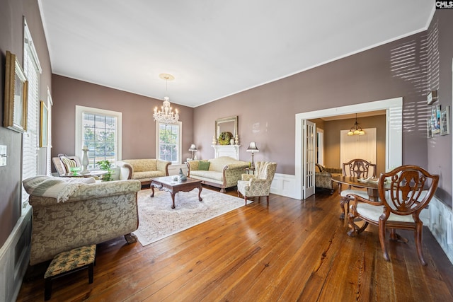 131 Pine St, Salley, SC 29137 - living room with a chandelier, hardwood / wood-style floors, crown molding, and a wainscoted wall