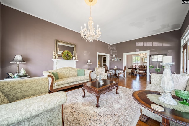 131 Pine St, Salley, SC 29137 - living area featuring crown molding, vaulted ceiling, an inviting chandelier, and wood finished floors