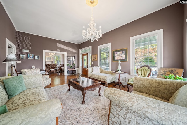 131 Pine St, Salley, SC 29137 - living area featuring wood finished floors, an inviting chandelier, ornamental molding, and a wealth of natural light