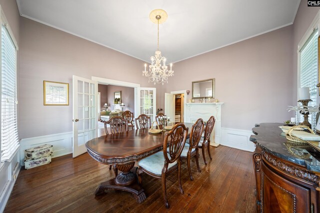 131 Pine St, Salley, SC 29137 - dining room featuring a decorative wall, ornamental molding, a chandelier, dark wood finished floors, and a wainscoted wall