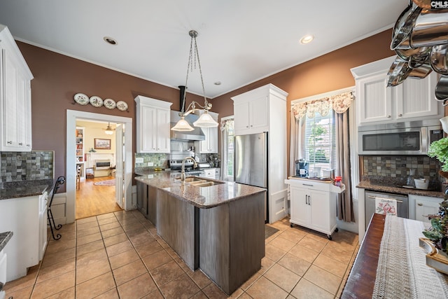 131 Pine St, Salley, SC 29137 - kitchen featuring light tile patterned flooring, appliances with stainless steel finishes, and decorative backsplash