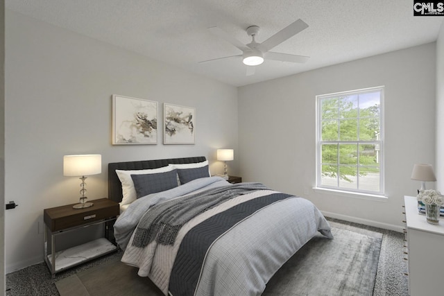 bedroom with baseboards, a ceiling fan, and carpet floors