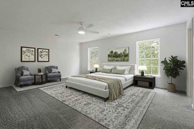carpeted bedroom with visible vents, baseboards, and a ceiling fan