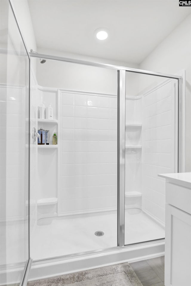 bathroom with vanity and a stall shower