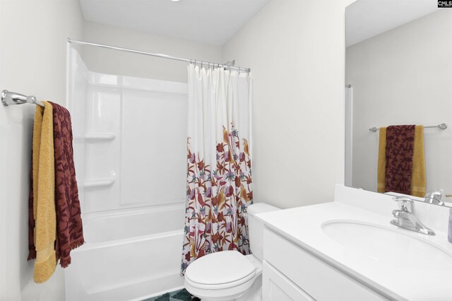 bathroom featuring shower / bath combo, vanity, and toilet