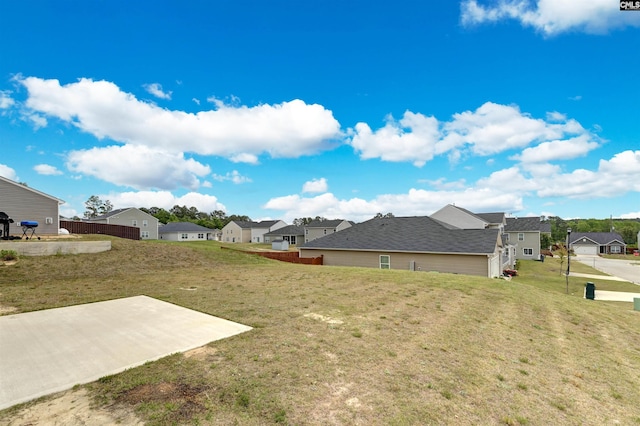 view of yard with a patio area and a residential view