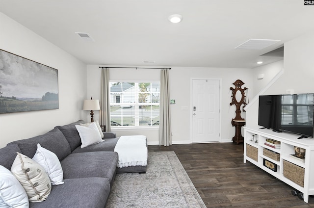 living room with visible vents, baseboards, recessed lighting, and wood finished floors