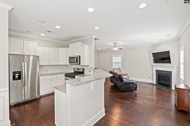 126 Sunset Bay Ln, Lexington, SC 29072 - kitchen featuring light stone countertops, a peninsula, visible vents, white cabinets, and appliances with stainless steel finishes