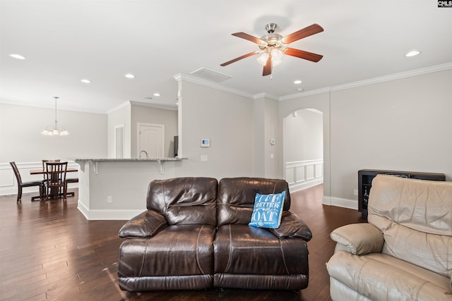 126 Sunset Bay Ln, Lexington, SC 29072 - living room with arched walkways, dark wood-style floors, crown molding, recessed lighting, and ceiling fan with notable chandelier