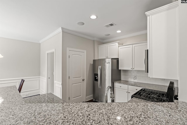 126 Sunset Bay Ln, Lexington, SC 29072 - kitchen featuring visible vents, range with gas stovetop, crown molding, and stainless steel fridge