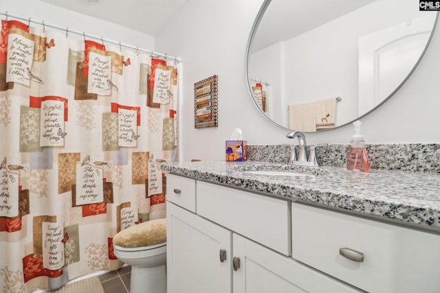 full bath with a shower with curtain, tile patterned floors, vanity, and toilet